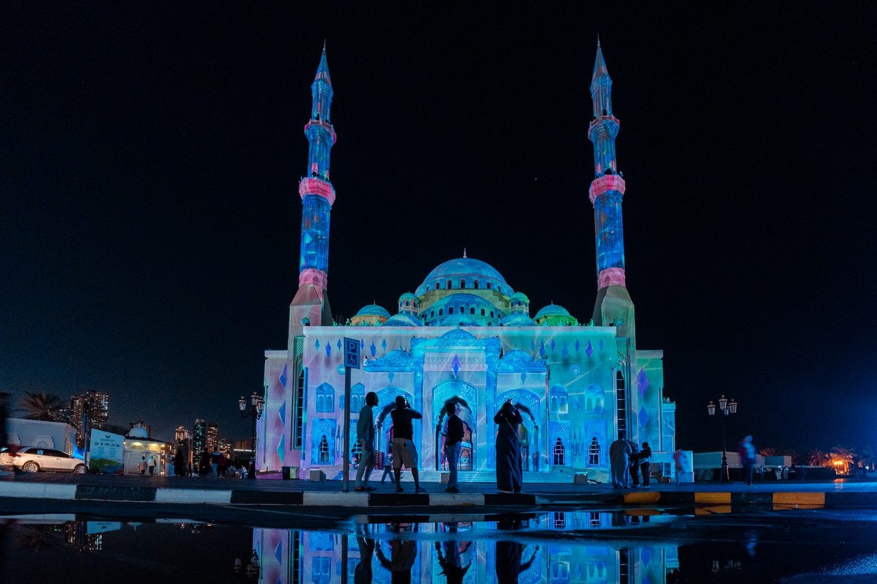 Pixelated cyan pattern across the mosque