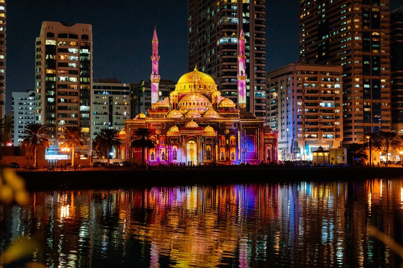 Wide lagoon view with mosque and city