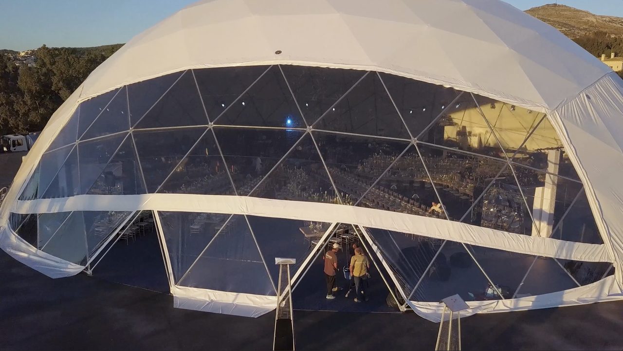 The dome on the hillside with crew