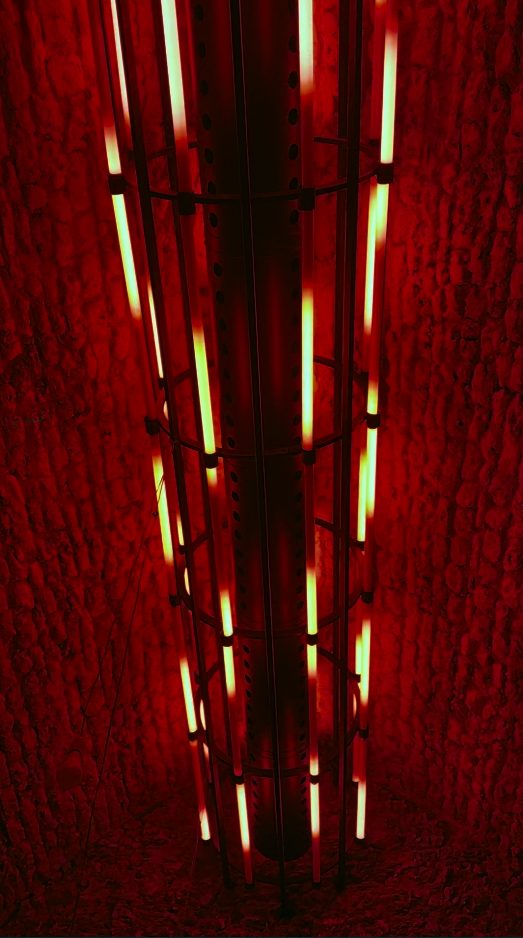 The ceiling cage lit blood-red