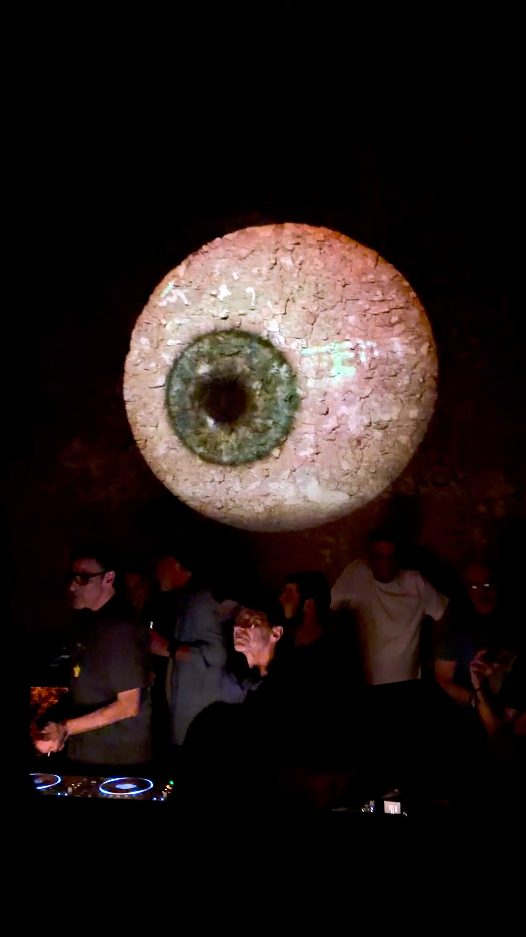 Giant eyeball hologram over the crowd