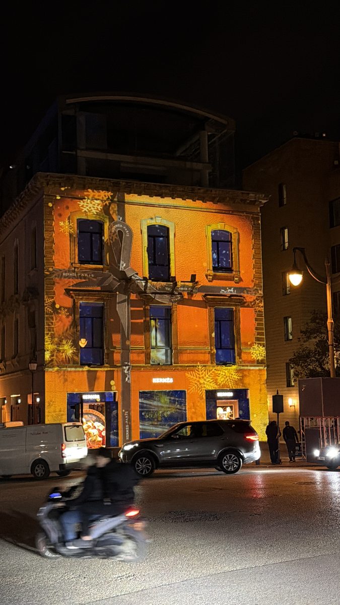 The bare Hermès façade at night before projection