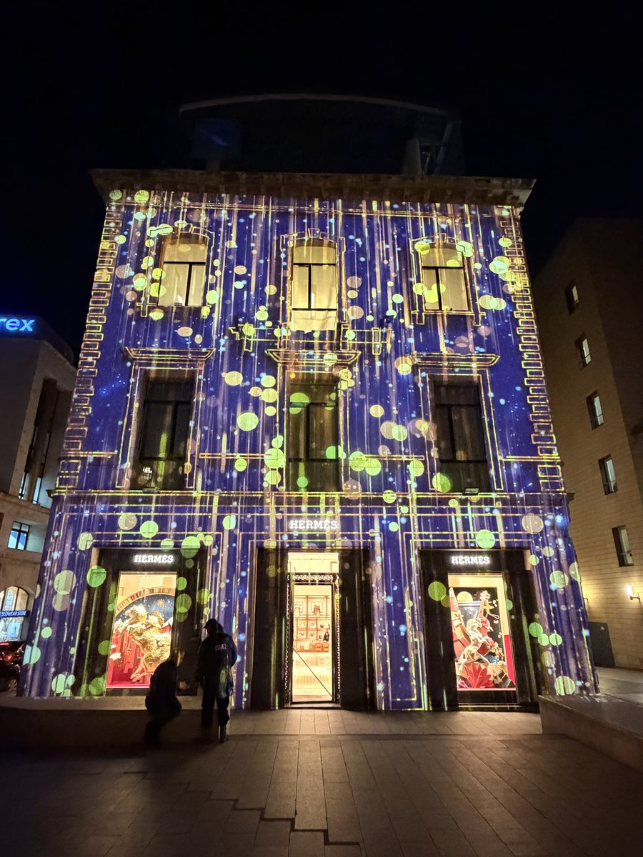 Festive starry façade with people