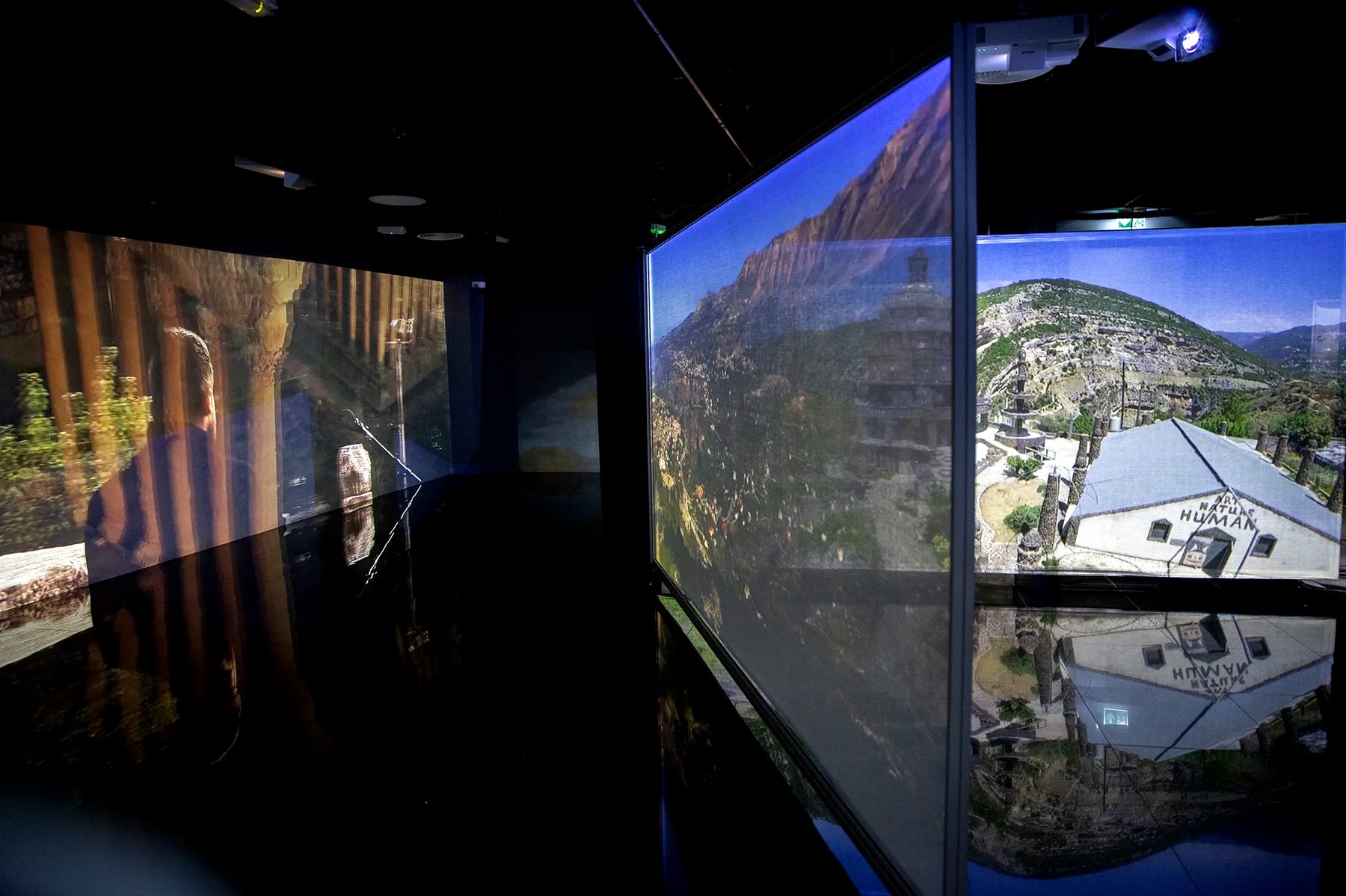 Multi-projection content room — fashion sequence reflected in the polished floor
