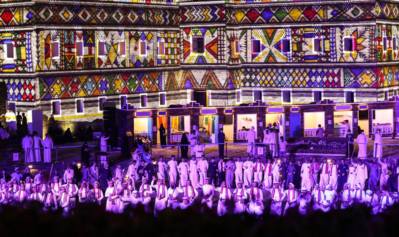 Crowd cue with dancers in white