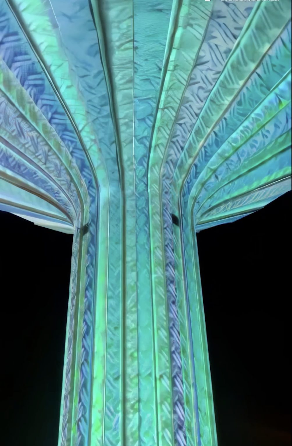 Water tower lit at night
