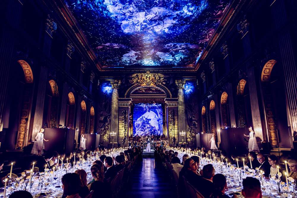 Van Cleef & Arpels gala dinner — cosmos projection across the Painted Hall ceiling
